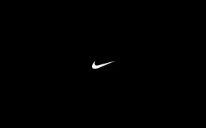 Создать мем: черные обои найк, nike на темном фоне, логотип найк на черном фоне