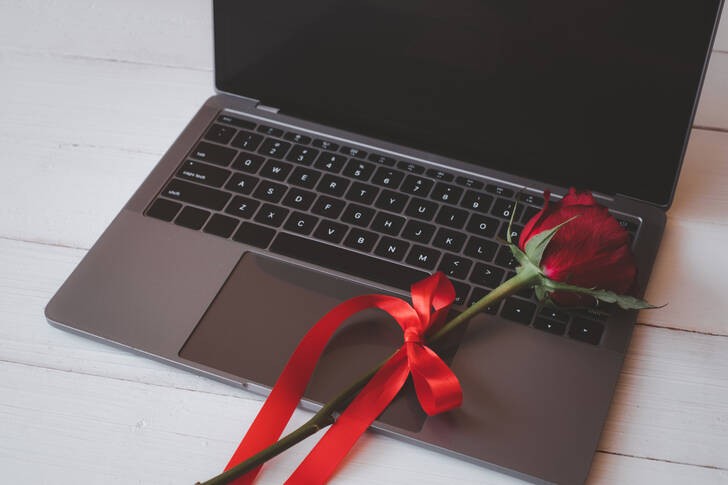 Create meme: a laptop as a gift, laptop , flowers on the keyboard