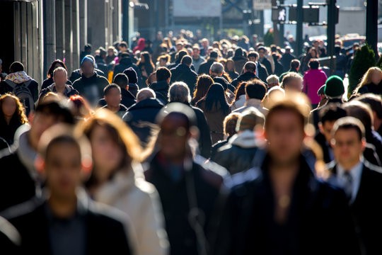 Create meme: a man in a crowd, feet , mass gathering of people