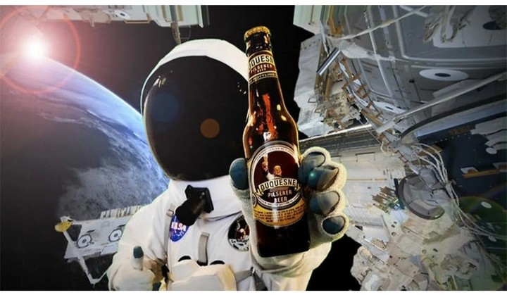 Create meme: cosmonaut carlsberg, beer in space, astronaut in space