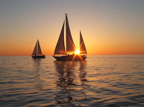 Create meme: sailboat at sunset, sailboat at sea, The ship at sunset