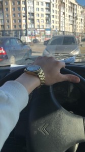 Create meme: the man behind the wheel photo, the view from the car, the watch on the wrist