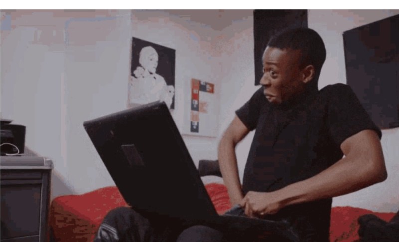 Create meme: meme a negro puts his hand in his pants, a black man with a laptop, Negro with a laptop