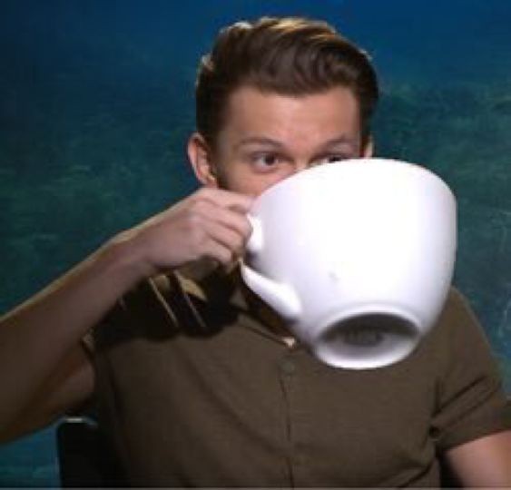 Create meme: Tom Holland coffee, Tom Holland with a mug, Tom Holland with a cup