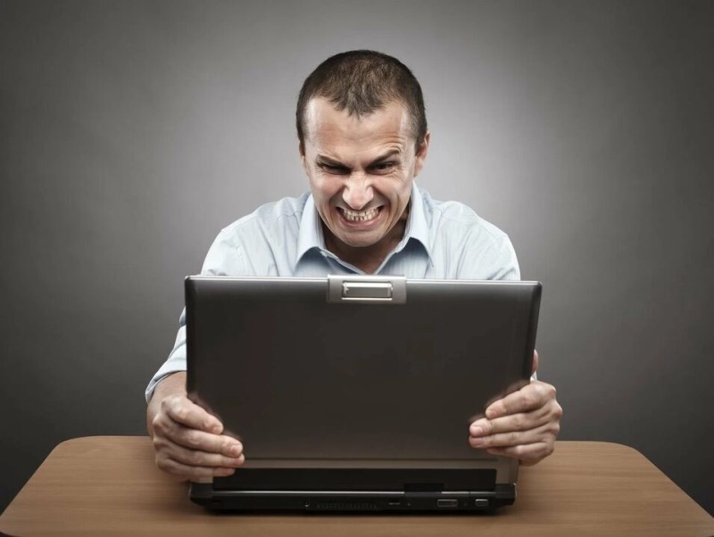 Create meme: angry businessman, the man in front of the laptop, screen 