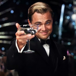 Create meme: DiCaprio's Gatsby with a glass of, Leonardo DiCaprio raises a glass, DiCaprio with a glass of