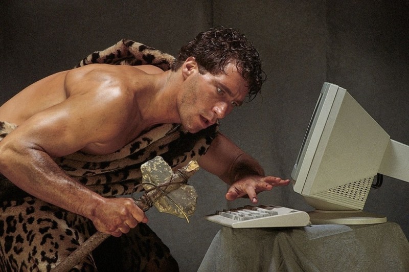 Create meme: the primitive man at the computer, A primitive man with a computer, The cave man meme