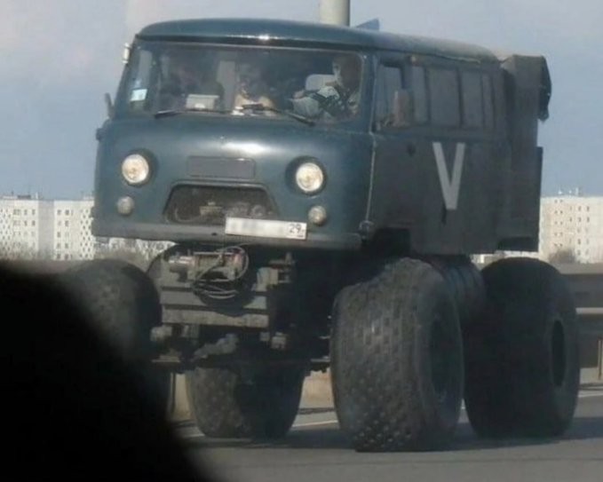 Create meme: uaz loaf on big wheels, uaz trackol all-terrain vehicles, uaz loaf swamp walker