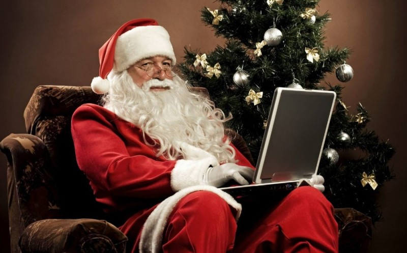 Create meme: santa claus, santa claus with a laptop, in the new year 