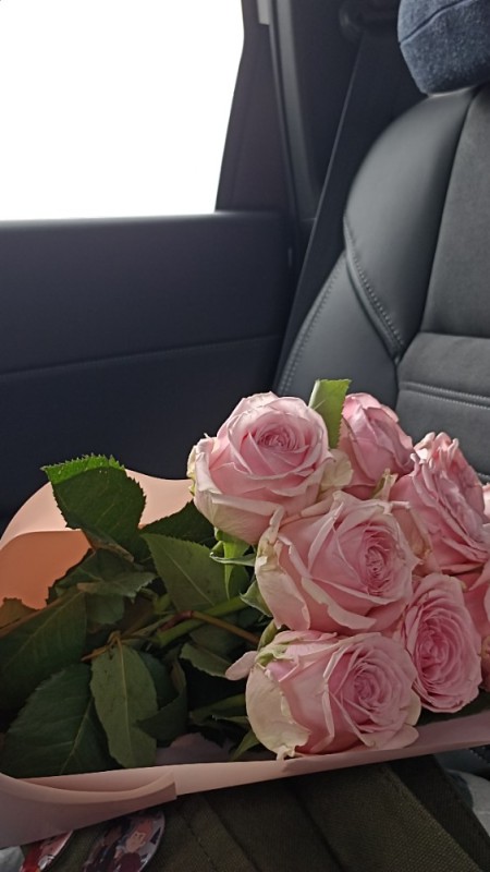Create meme: bouquet of flowers in the car, pink roses , flowers from the salon