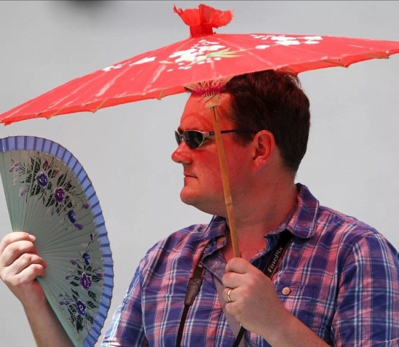 Create meme: umbrellas from the sun, male , a man with an umbrella