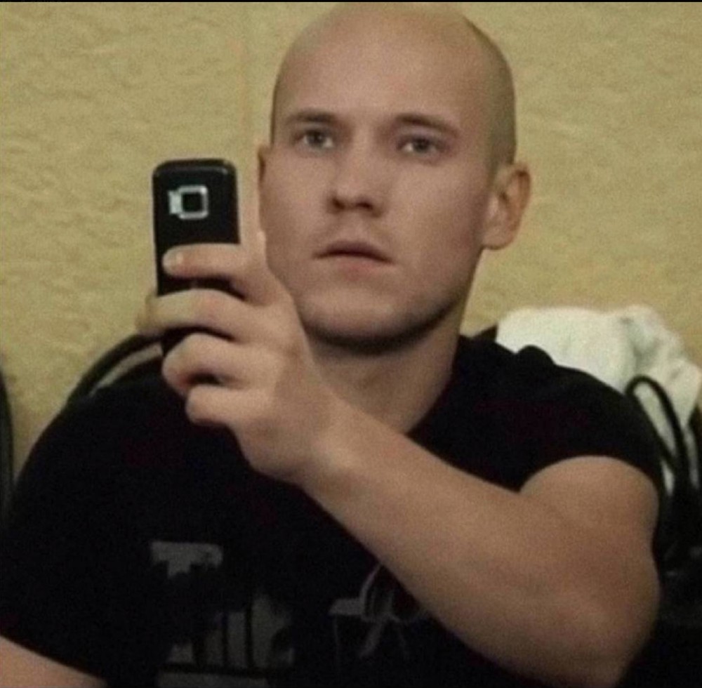 Create meme: Vladimir Selivanov real boys, Vova from real boys with a phone, The bald one from the real guys takes pictures