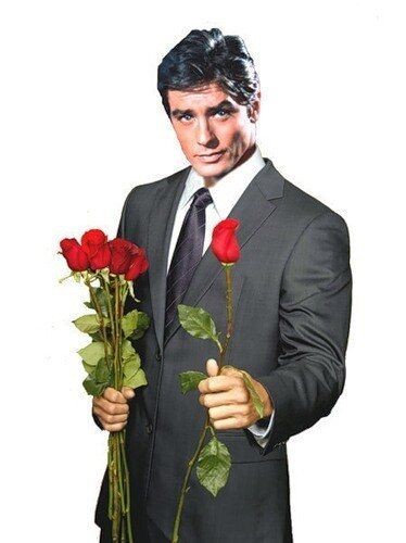 Create meme: man with flowers, a man gives flowers, Alain Delon on March 8th