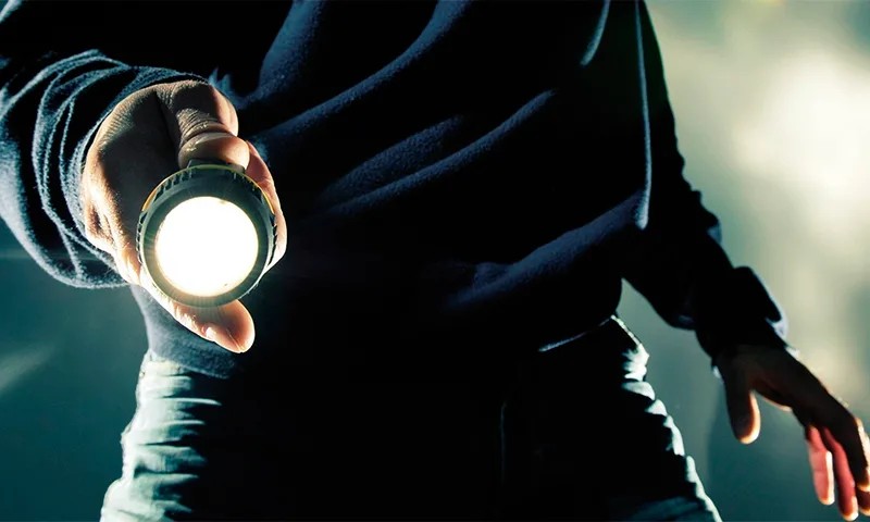 Create meme: The man with the flashlight, a man with a flashlight in his hand, hand with a flashlight