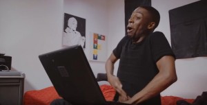 Create meme: a black man with a laptop, meme the Negro with a laptop, black man with hand in pants