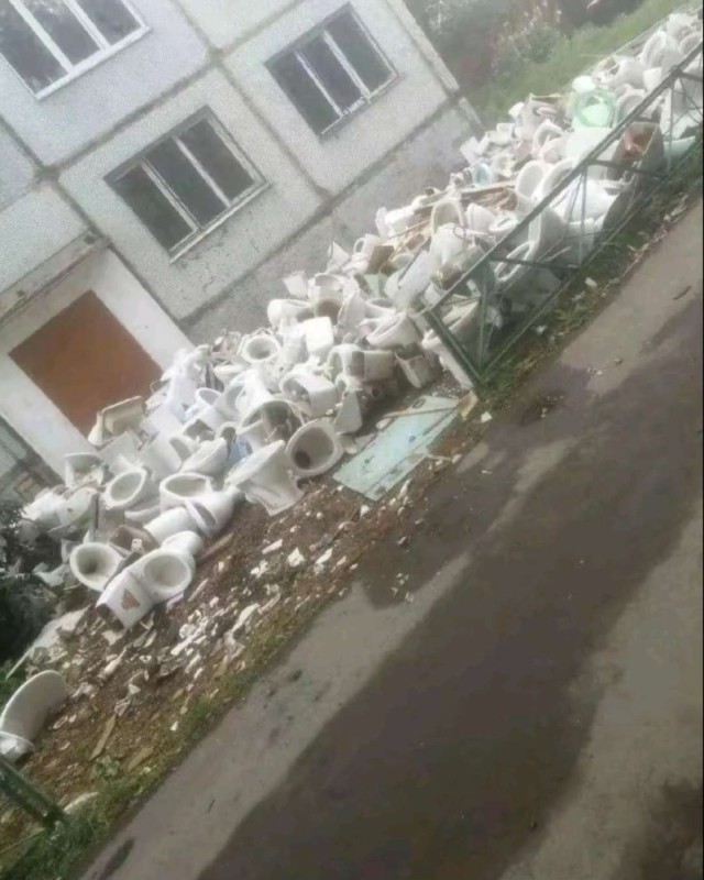 Create meme: the cemetery of toilets on Michurin, garbage can toilet, a bunch of toilets in the yard