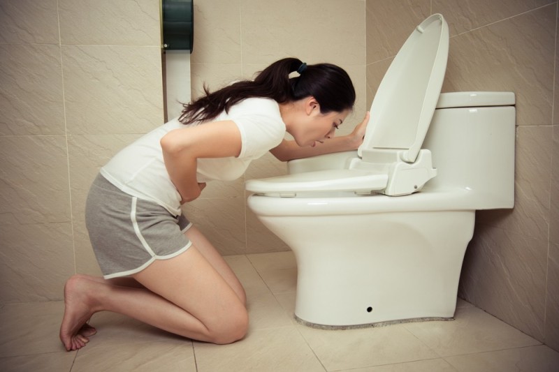 Create meme: the girl throws up in the toilet, barefoot woman is sick over the toilet, the girl near the toilet
