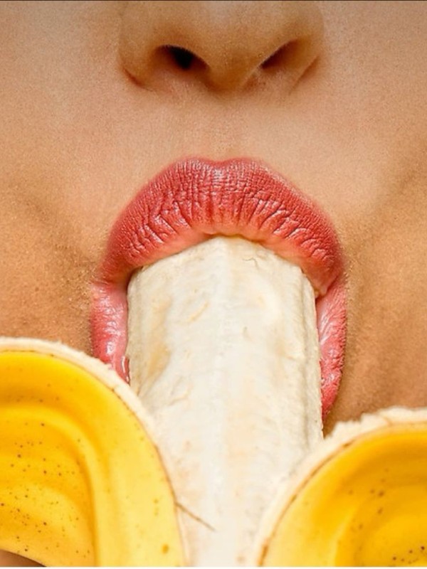 Create meme: girl sucking banana, a girl with a banana in her mouth, licking a banana