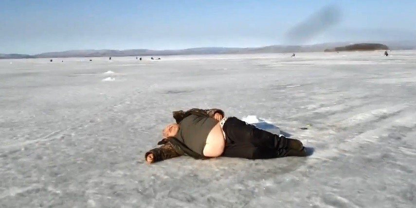 Create meme: man on ice, A fat man is lying on the ice, Sergey Kuznetsov namana