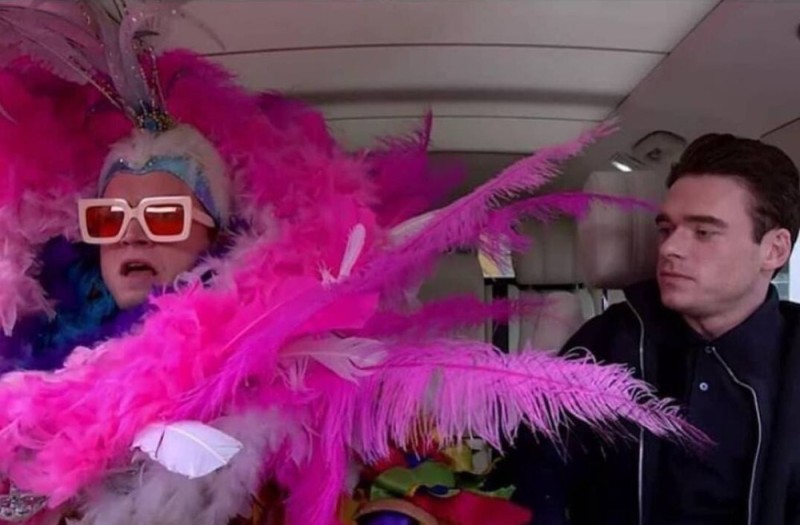 Create meme: Elton John, people , Elton John in feathers