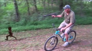 Create meme: a man on a bike with an Uzi, meme with a black man on a bike, jumping on the bike 32 wheels