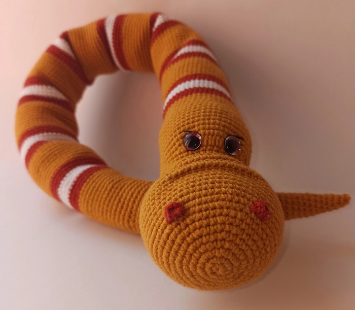 Create meme: knitted snake toy, knitted toy, knitted snake