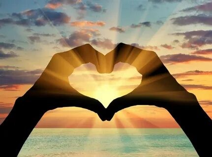 Create meme: a heart at sunset, love under the sun, A heart from the hands at sunset
