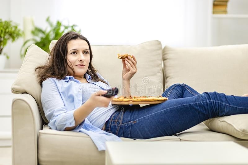 Create meme: a woman is sitting on the sofa, the girl is lying on the couch, a woman is lying on the sofa