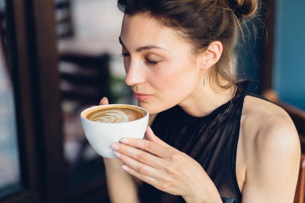 Create meme: girl drinking coffee, coffee girl, a woman drinks coffee