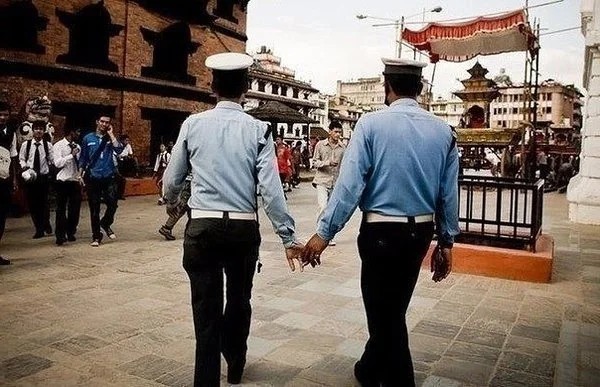 Create meme: Indian police officers, In India, men hold hands, Men holding hands