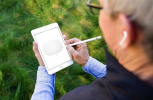 Create meme: hand holding smartphone on a grass background, mobile phone, apogee duet for ipad and mac