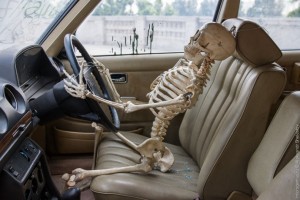 Создать мем: in car, картинка скелет в машине