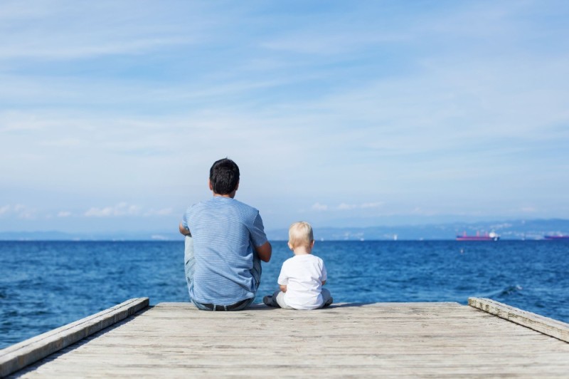 Create meme: Dad and son at the marina, Father and son are sitting by the sea, man at sea