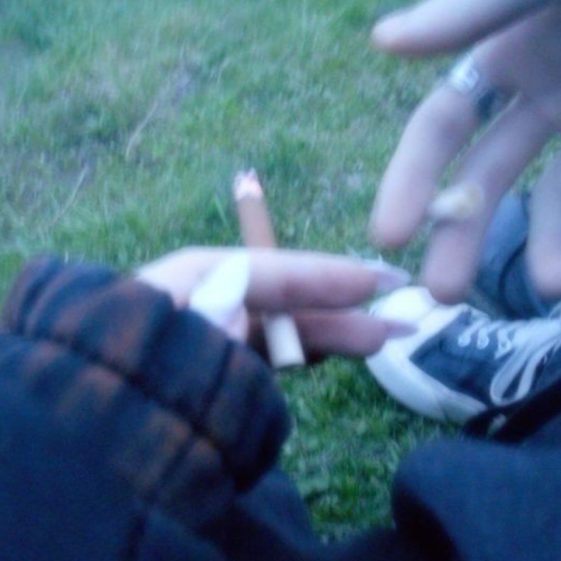 Create meme: feet , a pack of cigarettes, hand with a cigarette