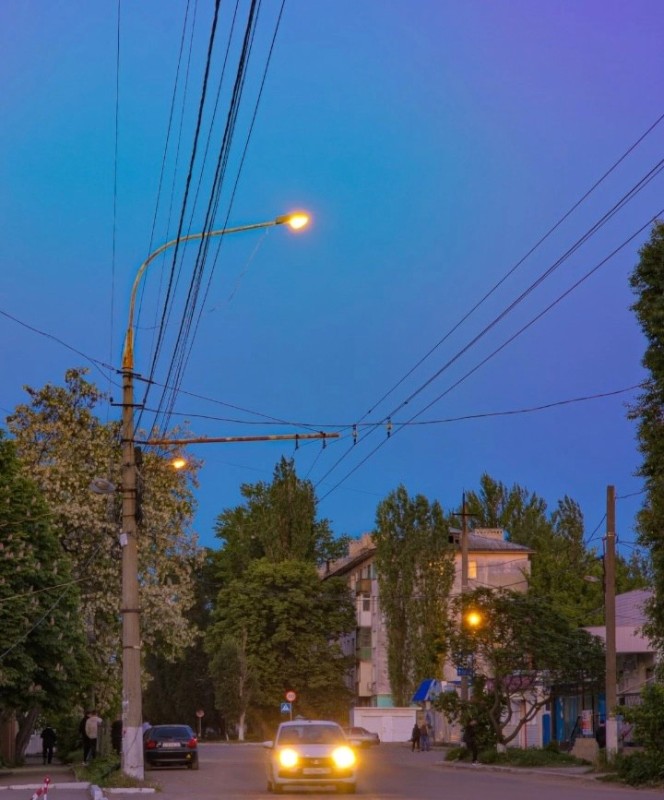 Create meme: street lighting, sunset , urban electric transport