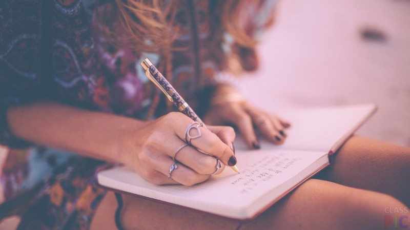 Create meme: the girl writes in a notebook, a girl with a notebook in her hands