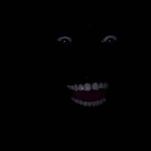 Create meme: scary face in the dark, ebony smiles in the dark, Negro in the dark with white teeth