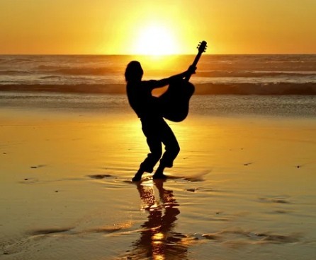 Create meme: silhouette of the guitarist, sunset beach, mobile version