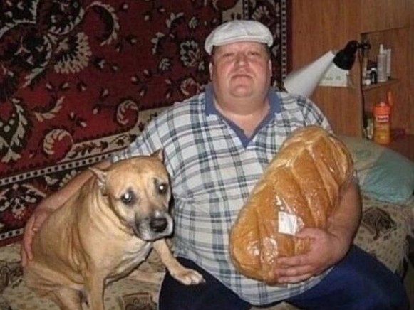 Create meme: a man with a loaf and a dog, a man is sitting with a loaf and a dog, greater baton