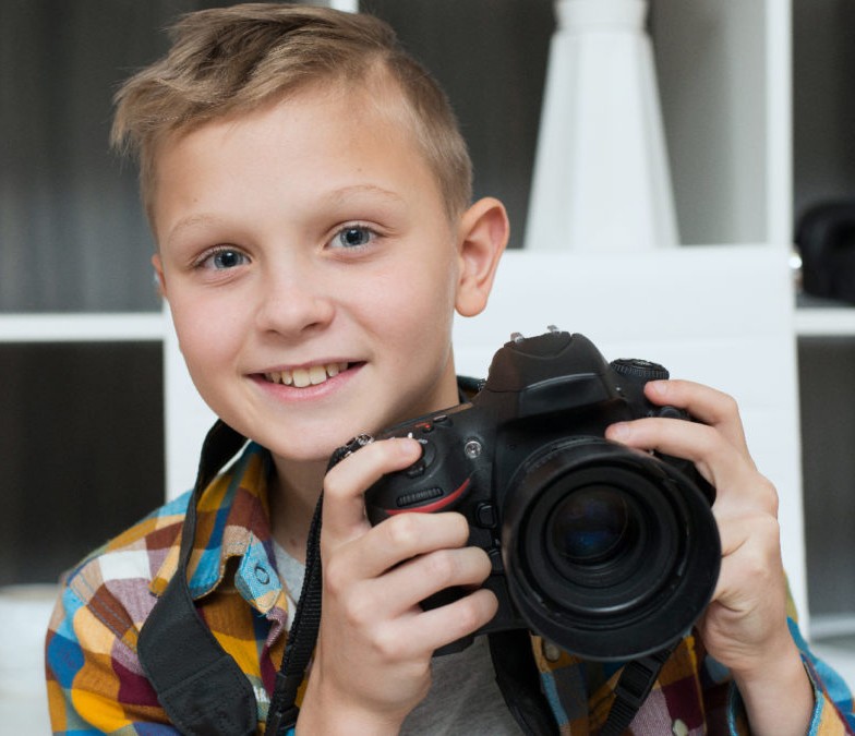 Create meme: a boy with a camera, children's photo shoots, boy 