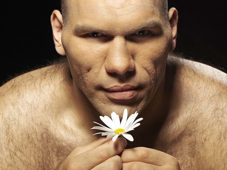 Create meme: Nikolai Valuev , valuev with flowers, Nikolai Valuev with chamomile