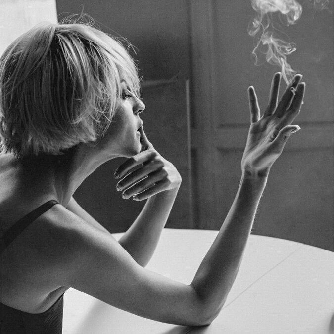 Create meme: Girl indifference, a girl with short hair smokes, blonde with short hair