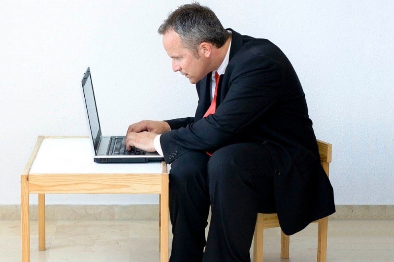 Create meme: sitting at the table, at the table , a person sitting at a computer