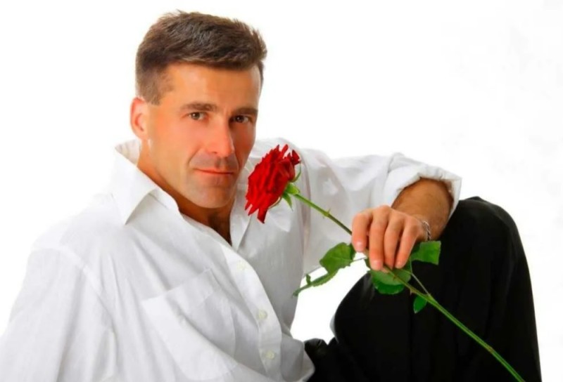Create meme: man with flowers, congratulations on March 8 to a man, flowers for a man