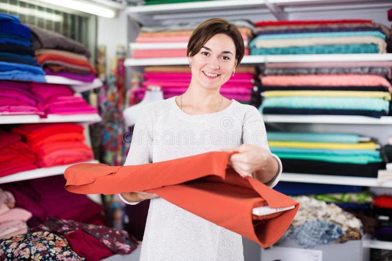 Create meme: fabric seller, a seller in a fabric store, the girl chooses the fabric