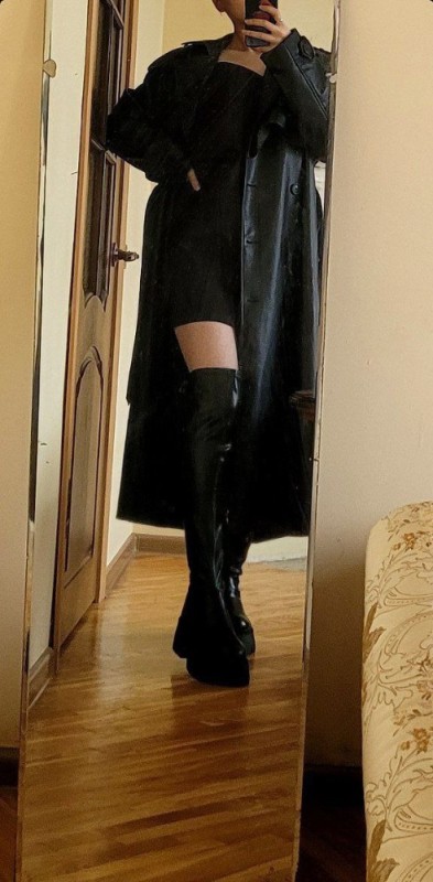 Create meme: lady natalie black, women's leather raincoat, long leather raincoat