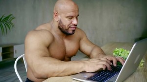 Create meme: Jock with a laptop, a wrestler with a laptop, a bald wrestler with a laptop