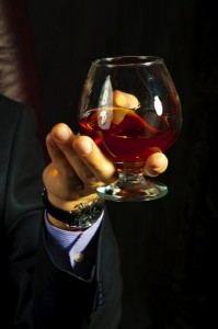 Create meme: a glass of cognac in hand