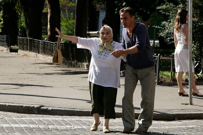 Create meme: transfer grandma across the street, the boy takes his grandmother across the street, a man takes his grandmother across the street