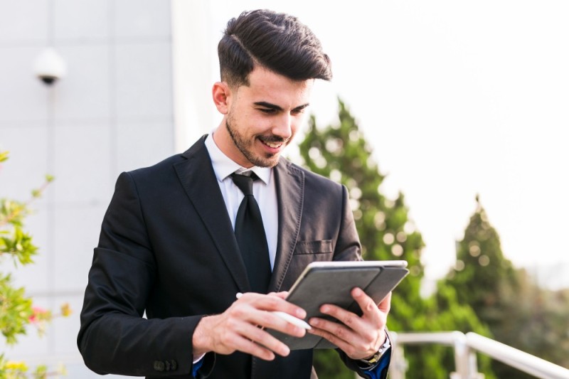 Create meme: business man, male , The man with the tablet